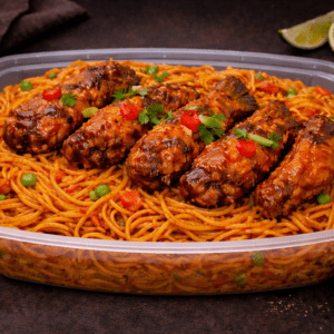 Jollof spaghetti with sauced chicken wings